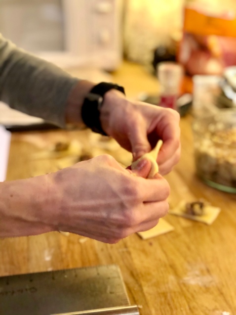 Filling the casoncelli and molding into candy-shaped pasta
